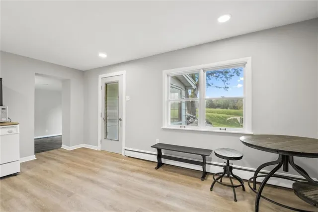 a view of a livingroom with furniture and a window