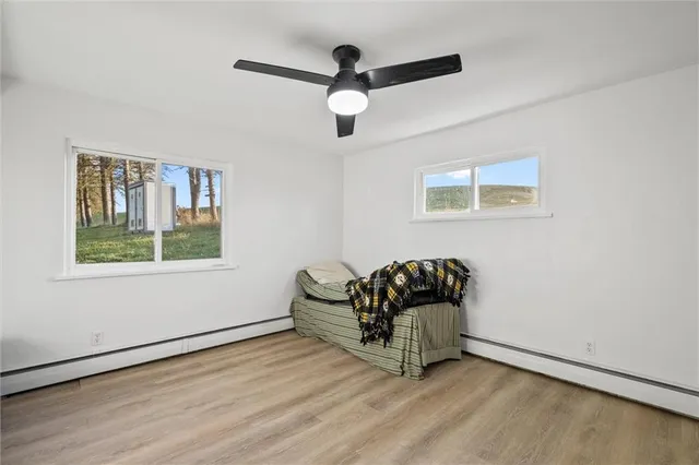 a living room with hard wood floor