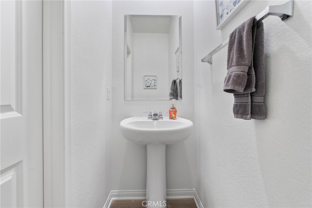 1634 Crepe Myrtle Place Upland, CA 91784 - Photo 11 of 41 a bathroom with a sink and a mirror