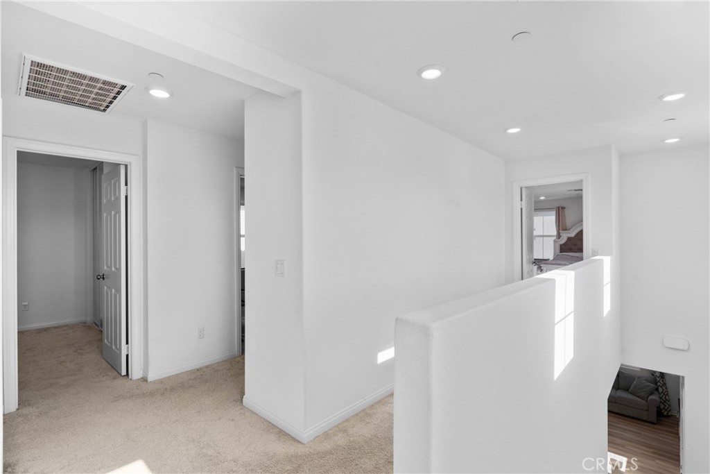 1634 Crepe Myrtle Place Upland, CA 91784 - Photo 12 of 41 a view of a hallway with closet and bathroom