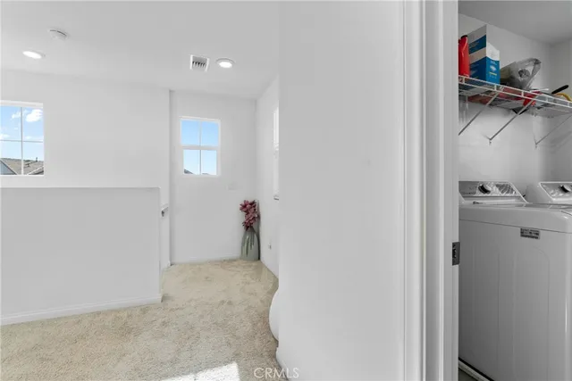 a view of a storage & utility room with a window