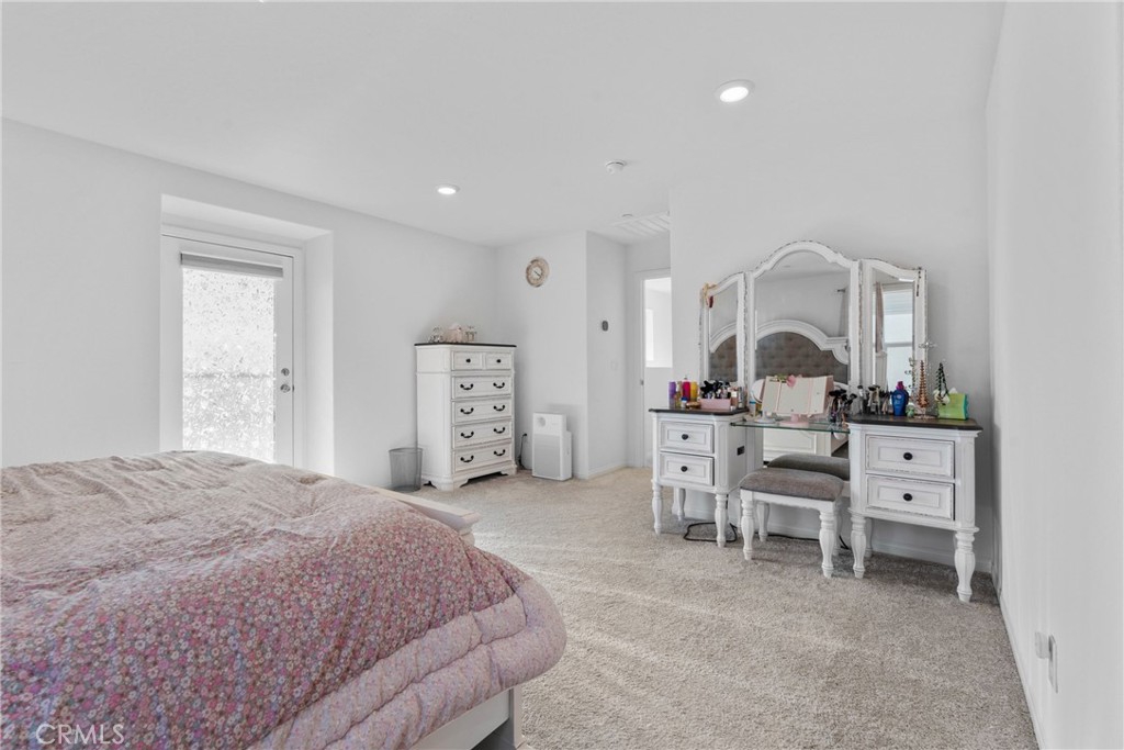 1634 Crepe Myrtle Place Upland, CA 91784 - Photo 15 of 41 a bed room with a bed and a chair