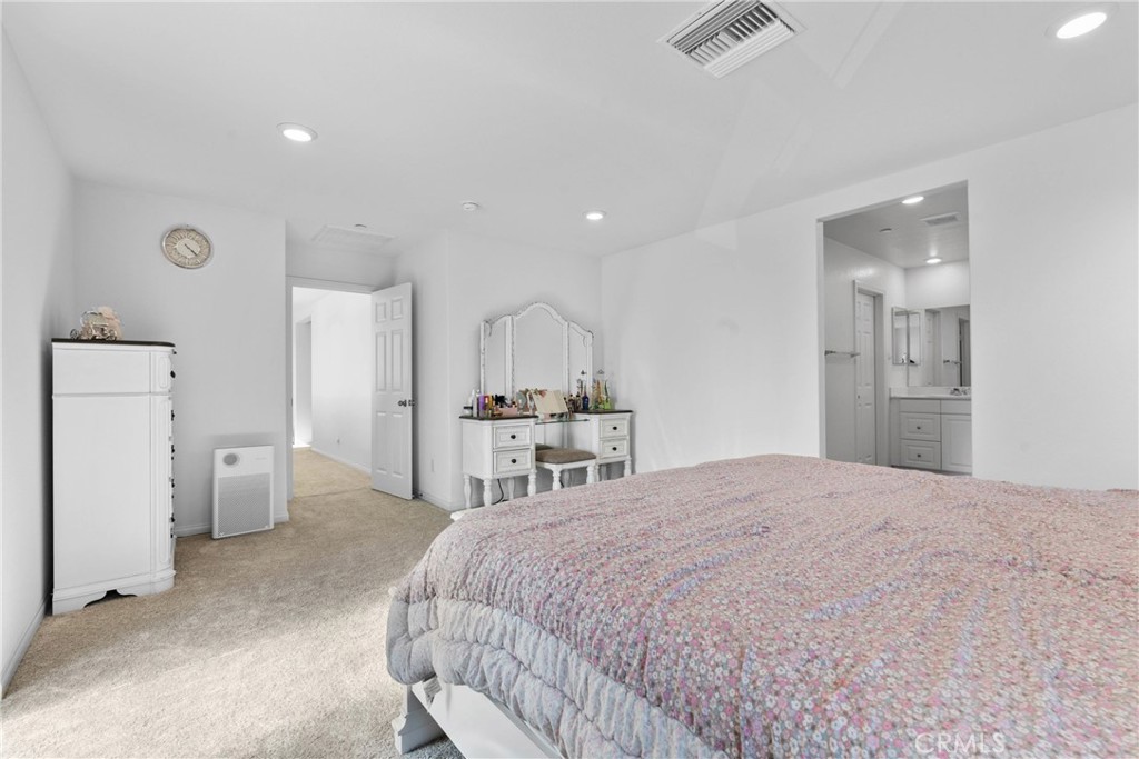 1634 Crepe Myrtle Place Upland, CA 91784 - Photo 16 of 41 a spacious bedroom with a bed and a refrigerator