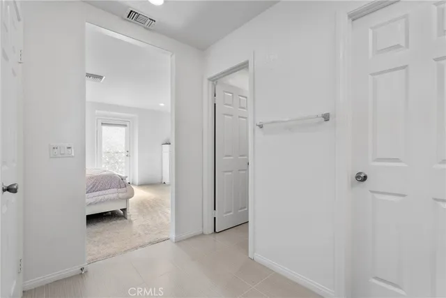 a bedroom with a bed and a bathroom