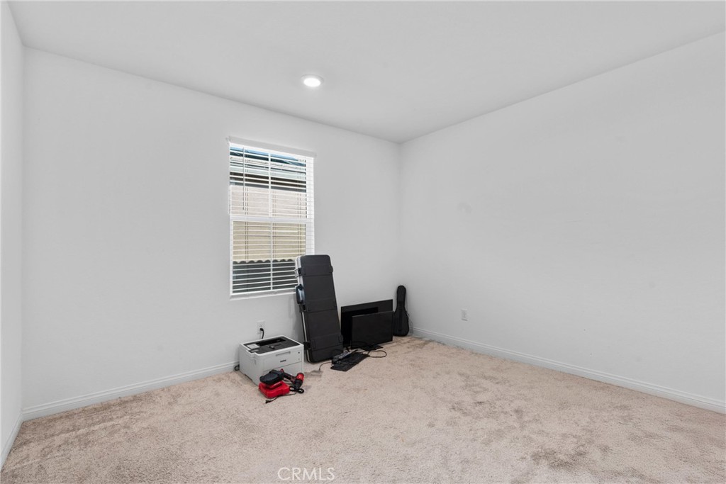 1634 Crepe Myrtle Place Upland, CA 91784 - Photo 20 of 41 a room with furniture and window
