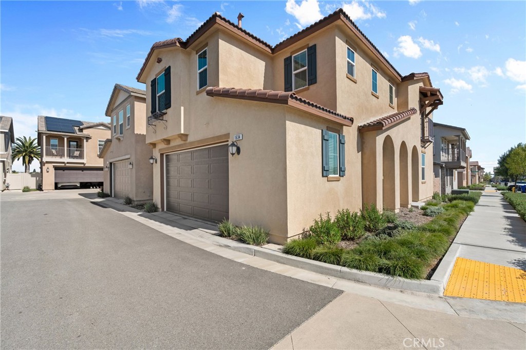 1634 Crepe Myrtle Place Upland, CA 91784 - Photo 25 of 41 a front view of a house with a yard