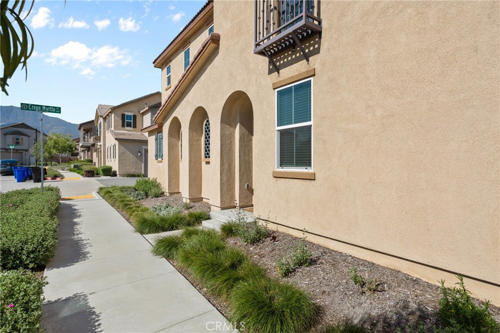 1634 Crepe Myrtle Place Upland, CA 91784 - Photo 26 of 41 a front view of a house with a yard