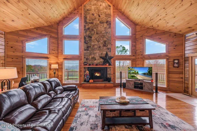 a dining room with furniture and wooden floor