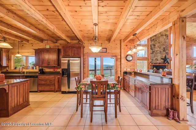 a bathroom with a granite countertop sink a mirror and bathtub