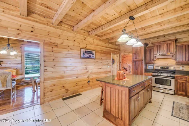 a living room with furniture and wooden floors