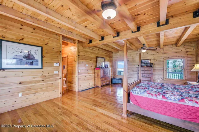 a kitchen with stainless steel appliances a stove a sink and white cabinets