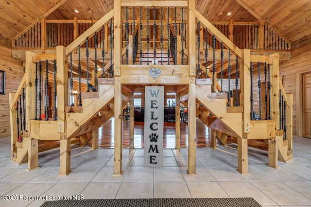 a living room with furniture a fireplace and a table
