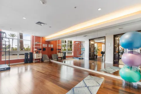 a lobby with furniture and floor to ceiling window