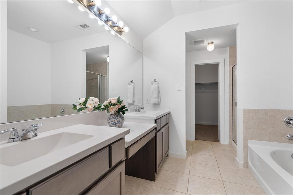 1620 Meadow Trail Lane Aubrey, TX 76227 - Photo 18 of 29 Luxurious primary bathroom featuring a double sink vanity and a separate vanity area!