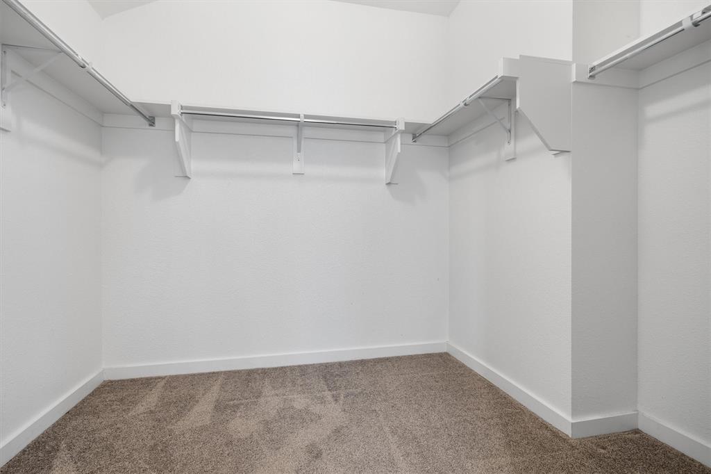 1620 Meadow Trail Lane Aubrey, TX 76227 - Photo 20 of 29 Expansive walk-in closet providing abundant storage and an easy-to-navigate layout for all your wardrobe needs.