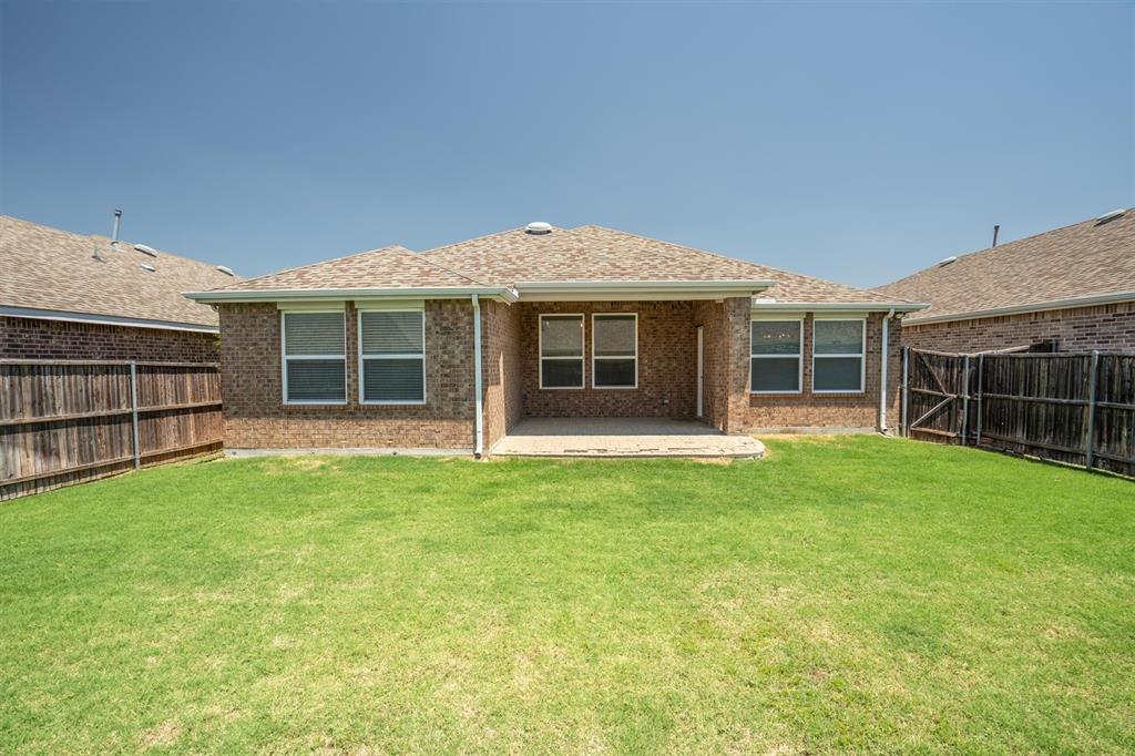 1620 Meadow Trail Lane Aubrey, TX 76227 - Photo 26 of 29 Oversized backyard offers plenty of lush, open greenspace.
