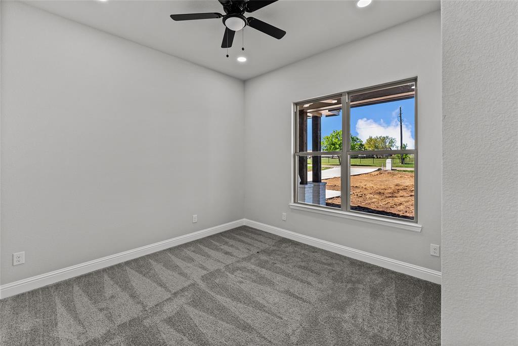8806 County Road 1229 Godley, TX 76044 - Photo 16 of 33 a view of an empty room with a window
