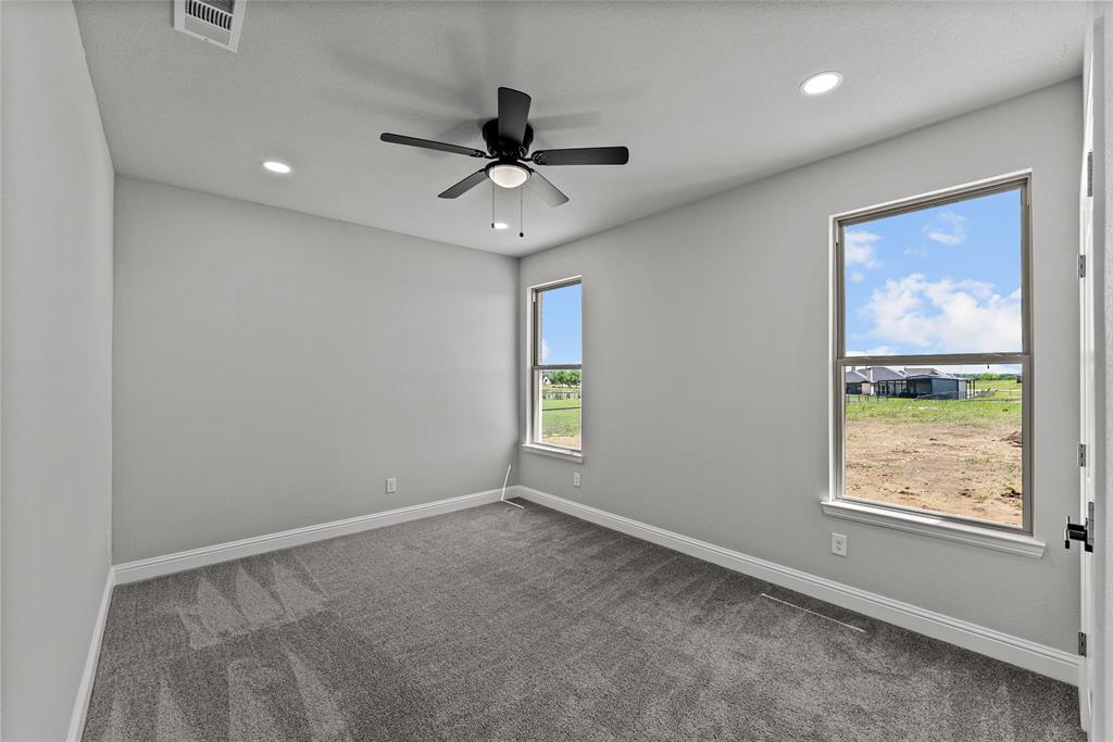 8806 County Road 1229 Godley, TX 76044 - Photo 21 of 33 a view of an empty room with a window