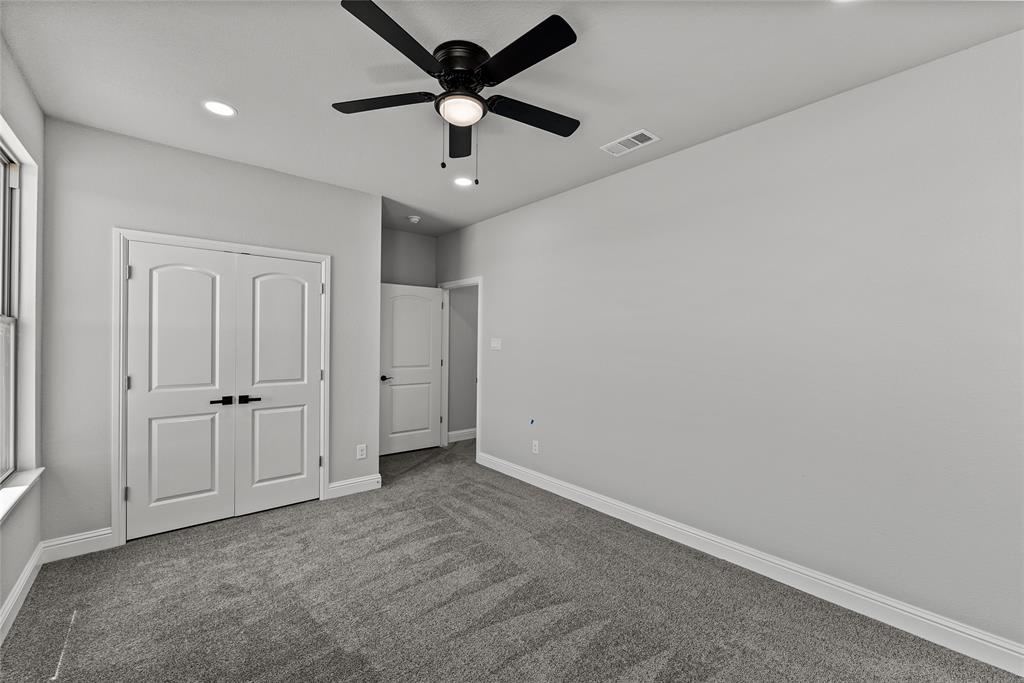 8806 County Road 1229 Godley, TX 76044 - Photo 22 of 33 an empty room with a ceiling fan