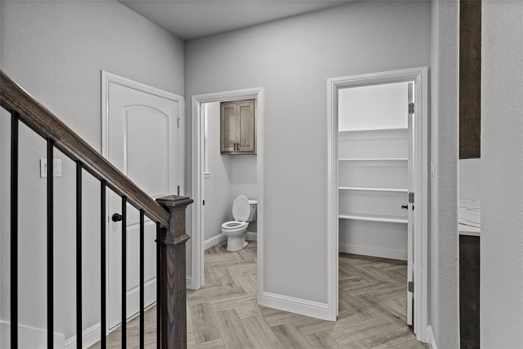8806 County Road 1229 Godley, TX 76044 - Photo 25 of 33 a view of a hallway with wooden floor and entryway