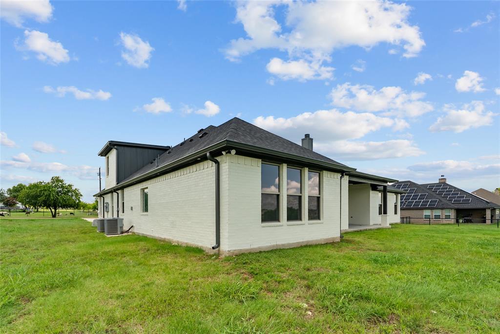 8806 County Road 1229 Godley, TX 76044 - Photo 32 of 33 a view of a house with a yard