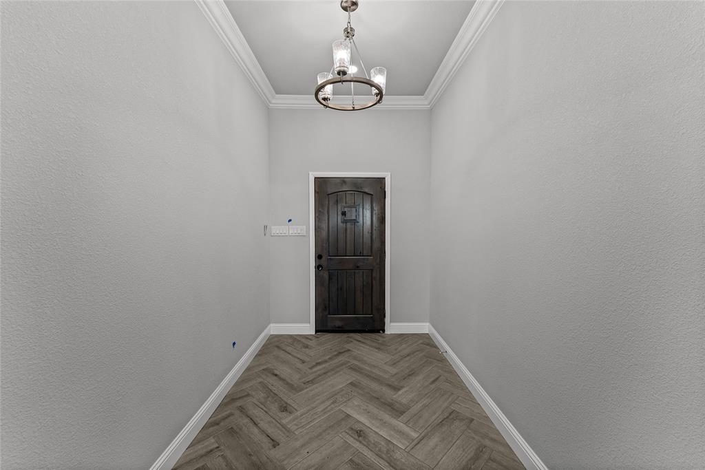 8806 County Road 1229 Godley, TX 76044 - Photo 8 of 33 a view of empty room with wooden floor