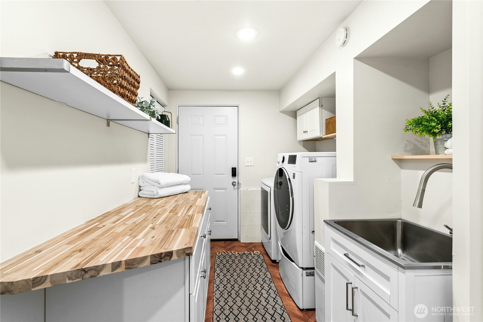 18152 145th Avenue Southeast Renton, WA 98058 - Photo 18 of 40 a kitchen with a sink and washing machine