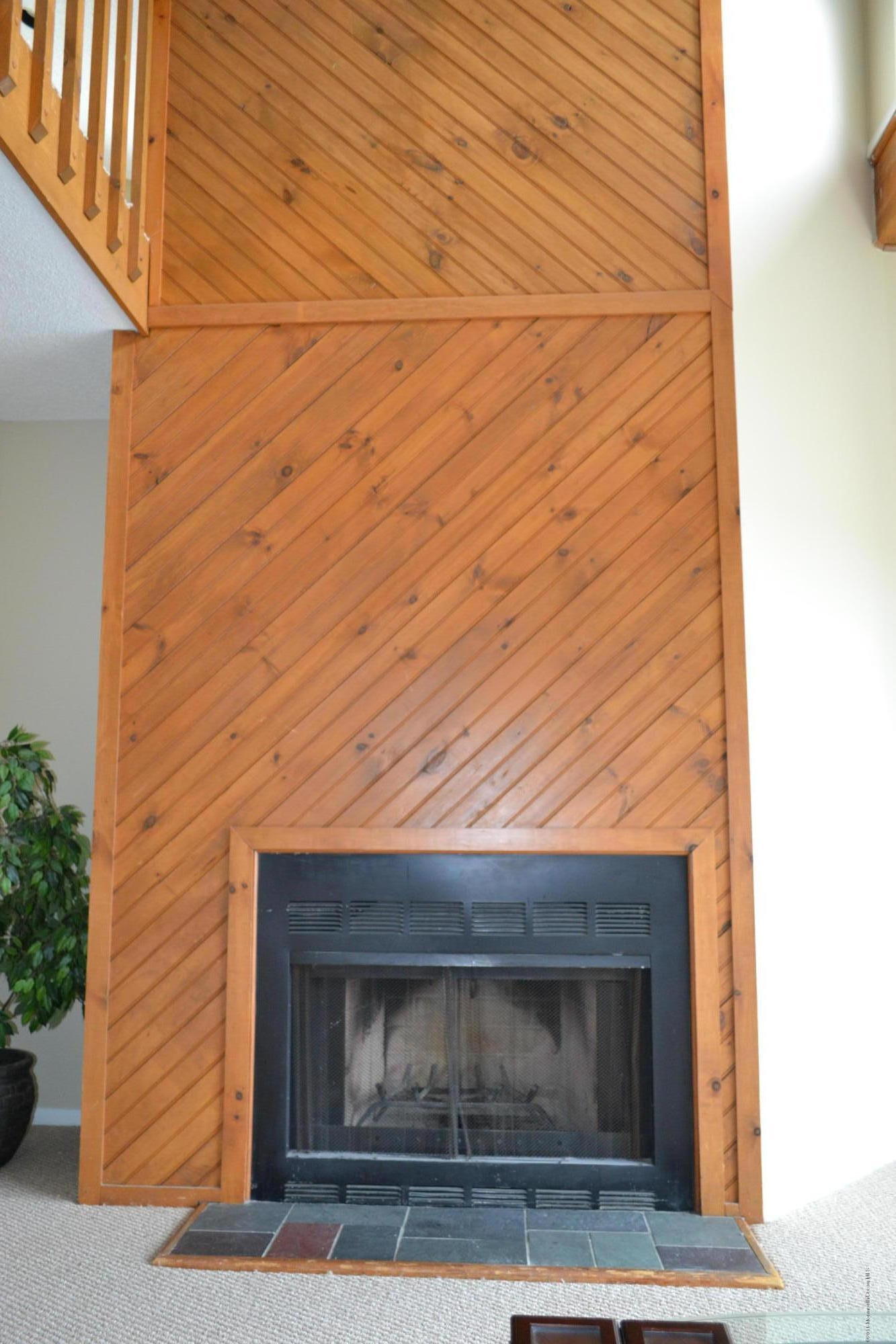 8 Hidden Harbor Drive Point Pleasant, NJ 08742 - Photo 19 of 37 a fireplace with a hallway