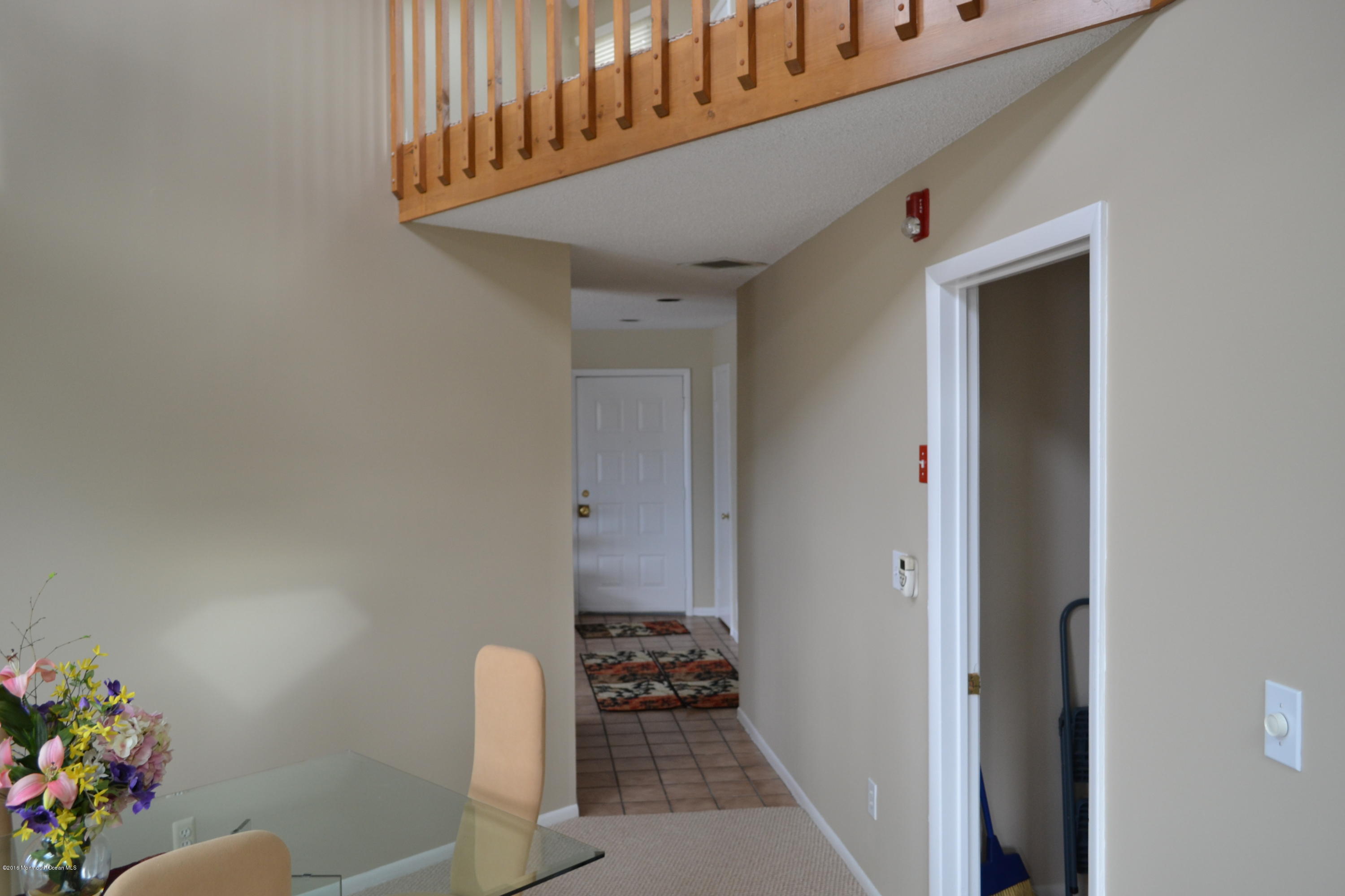 8 Hidden Harbor Drive Point Pleasant, NJ 08742 - Photo 20 of 37 a hallway with a dining table