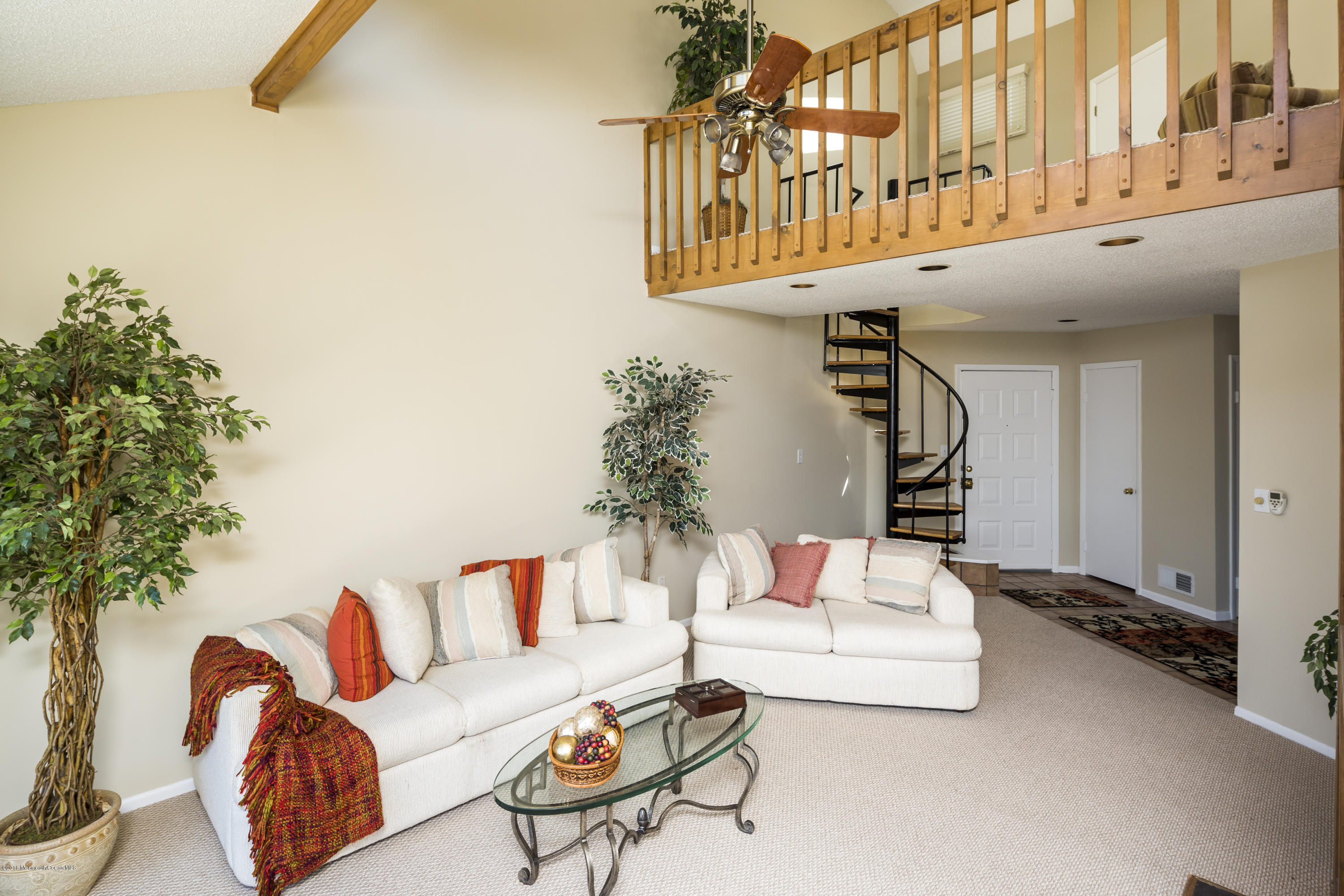 8 Hidden Harbor Drive Point Pleasant, NJ 08742 - Photo 23 of 37 a living room with furniture and a potted plant