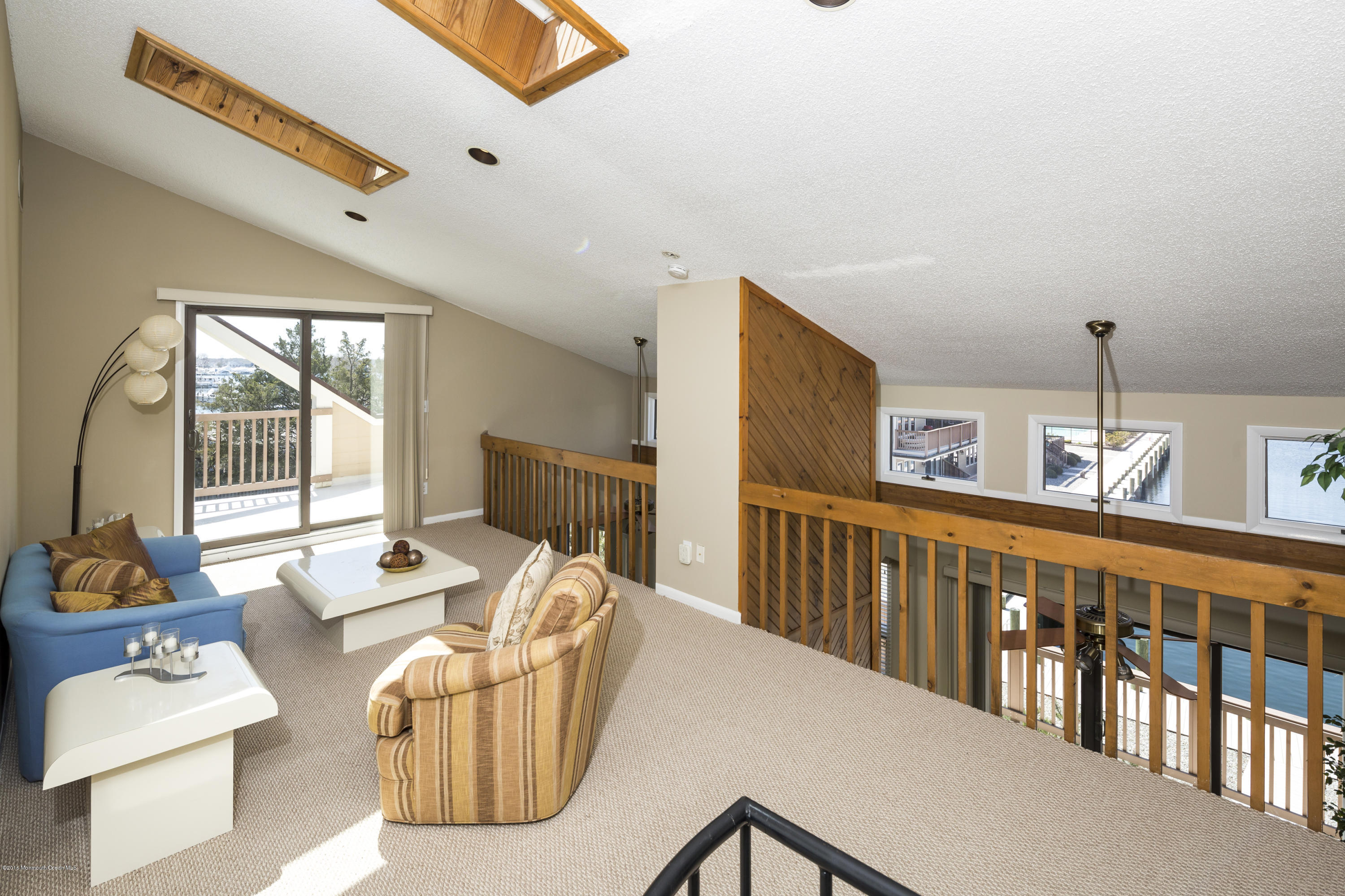 8 Hidden Harbor Drive Point Pleasant, NJ 08742 - Photo 31 of 37 a living room with furniture and a table