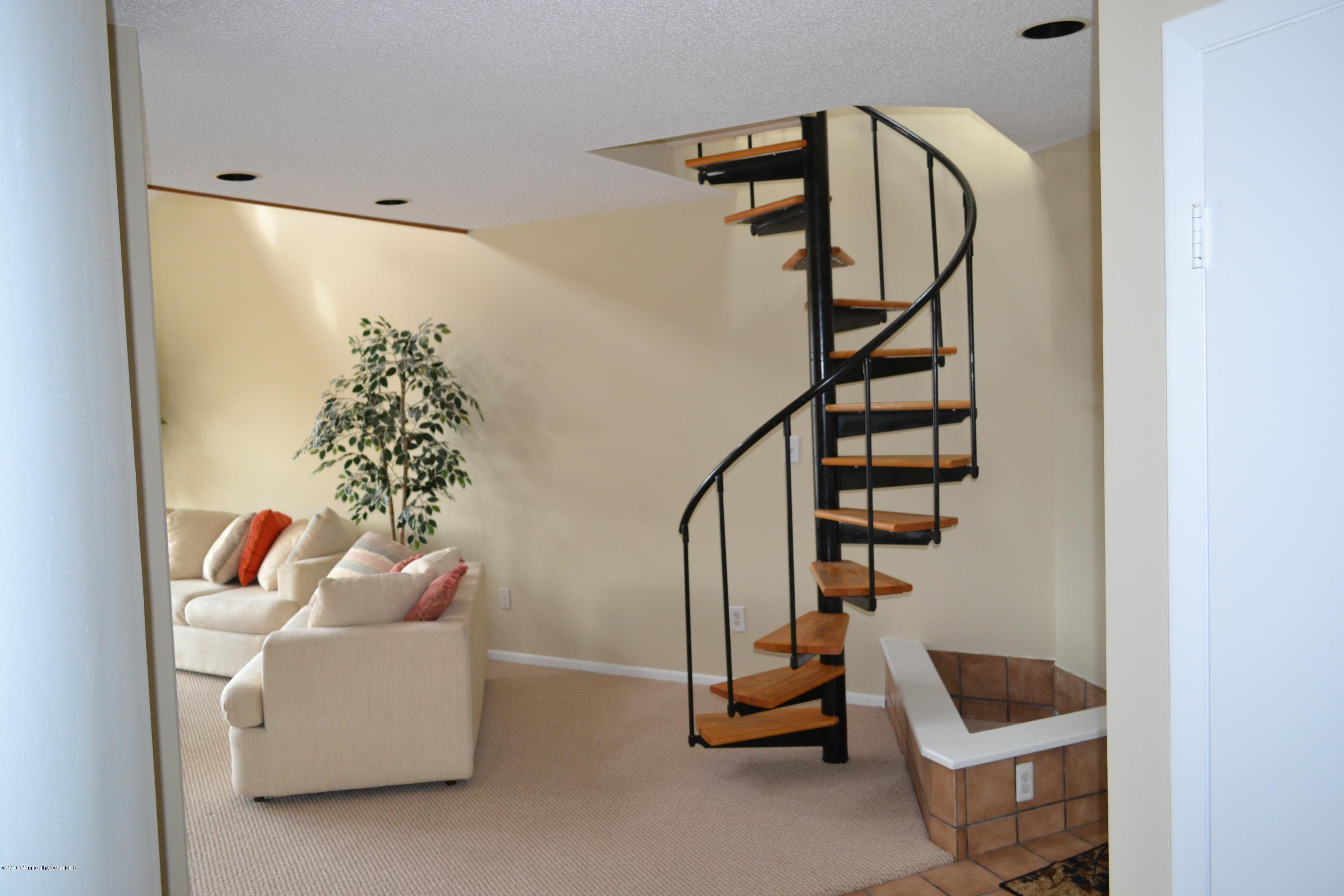 8 Hidden Harbor Drive Point Pleasant, NJ 08742 - Photo 6 of 37 a living room with furniture and stairs