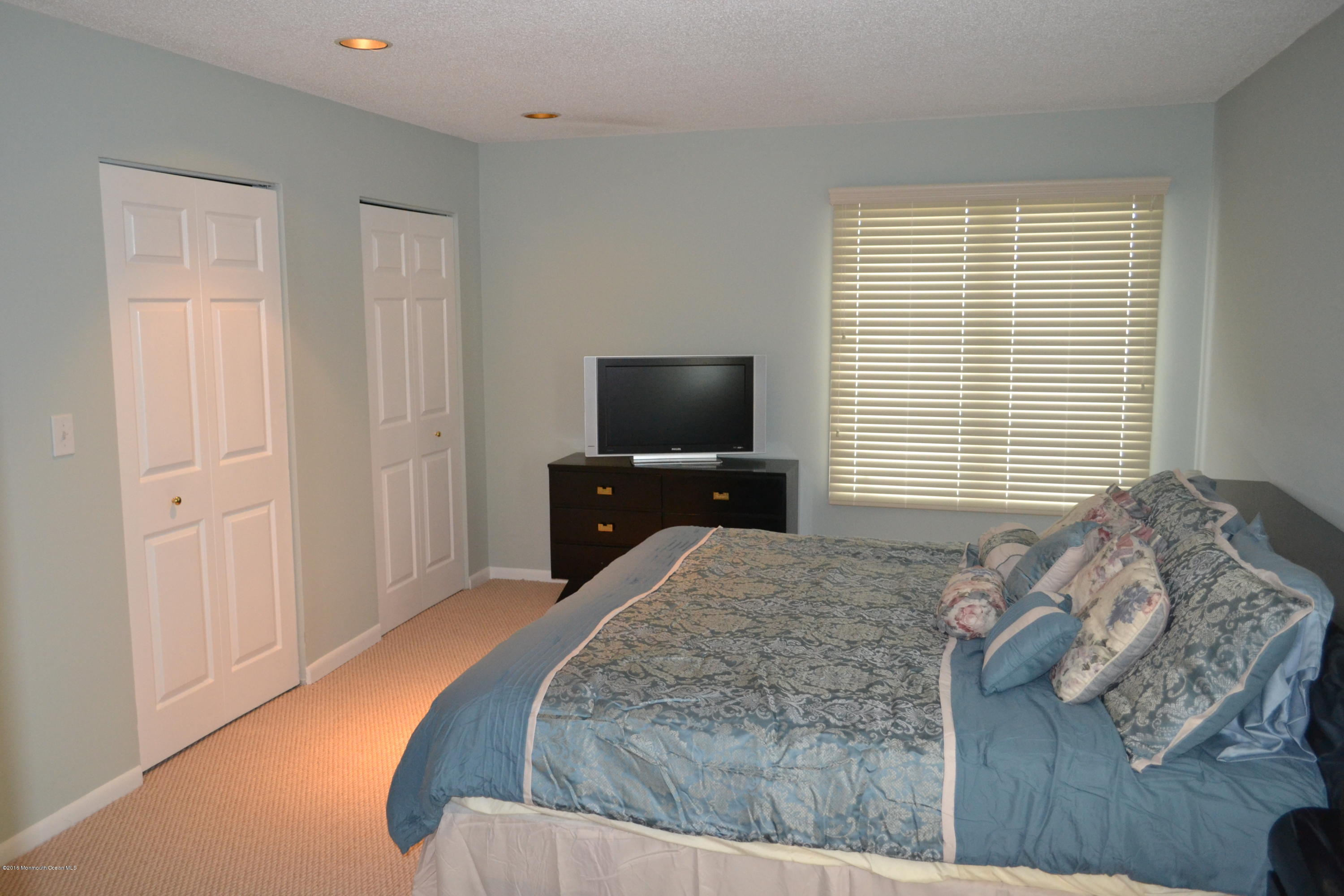 8 Hidden Harbor Drive Point Pleasant, NJ 08742 - Photo 7 of 37 a bedroom with a bed and a television