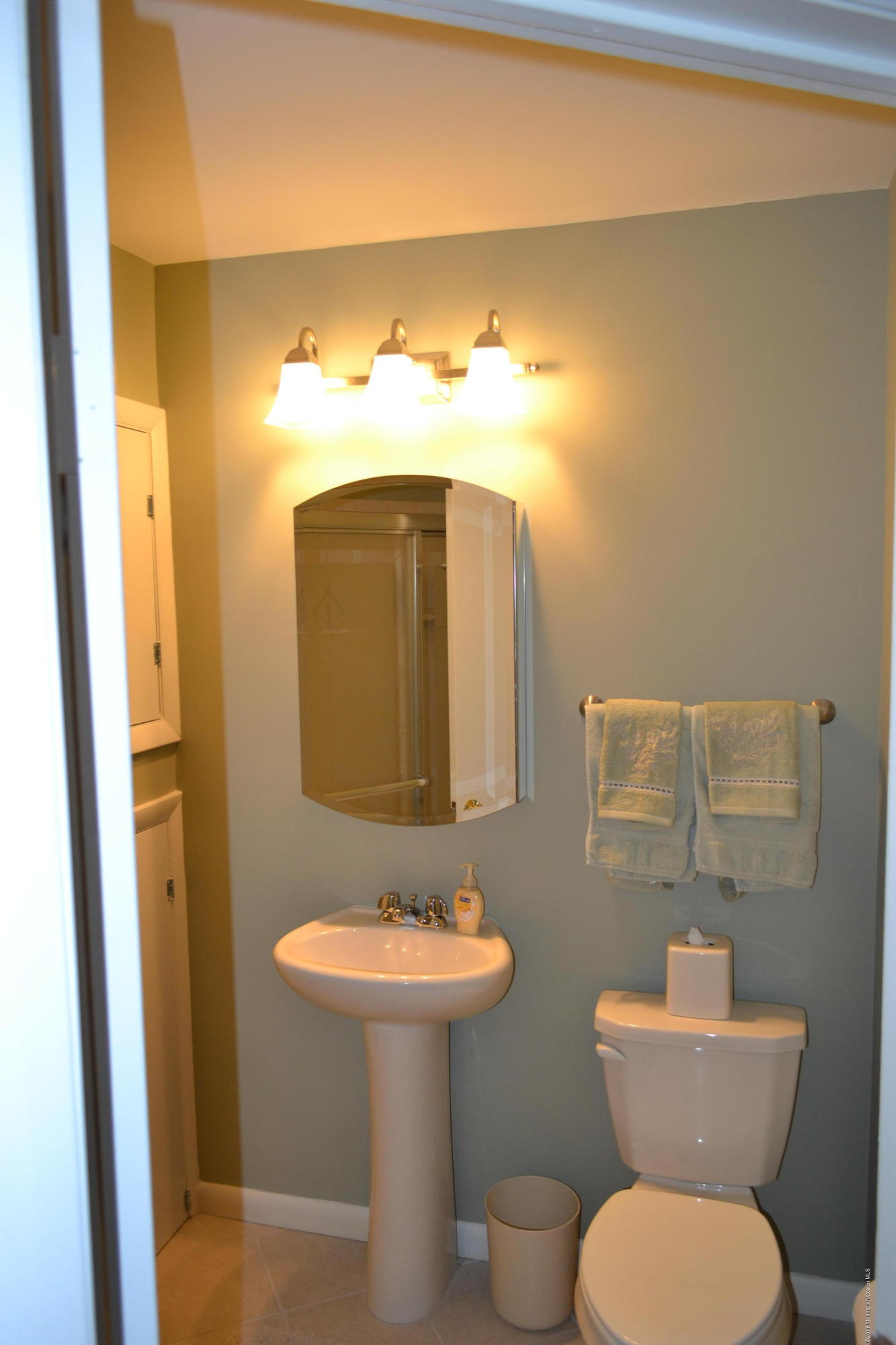 8 Hidden Harbor Drive Point Pleasant, NJ 08742 - Photo 8 of 37 a bathroom with a toilet sink and mirror