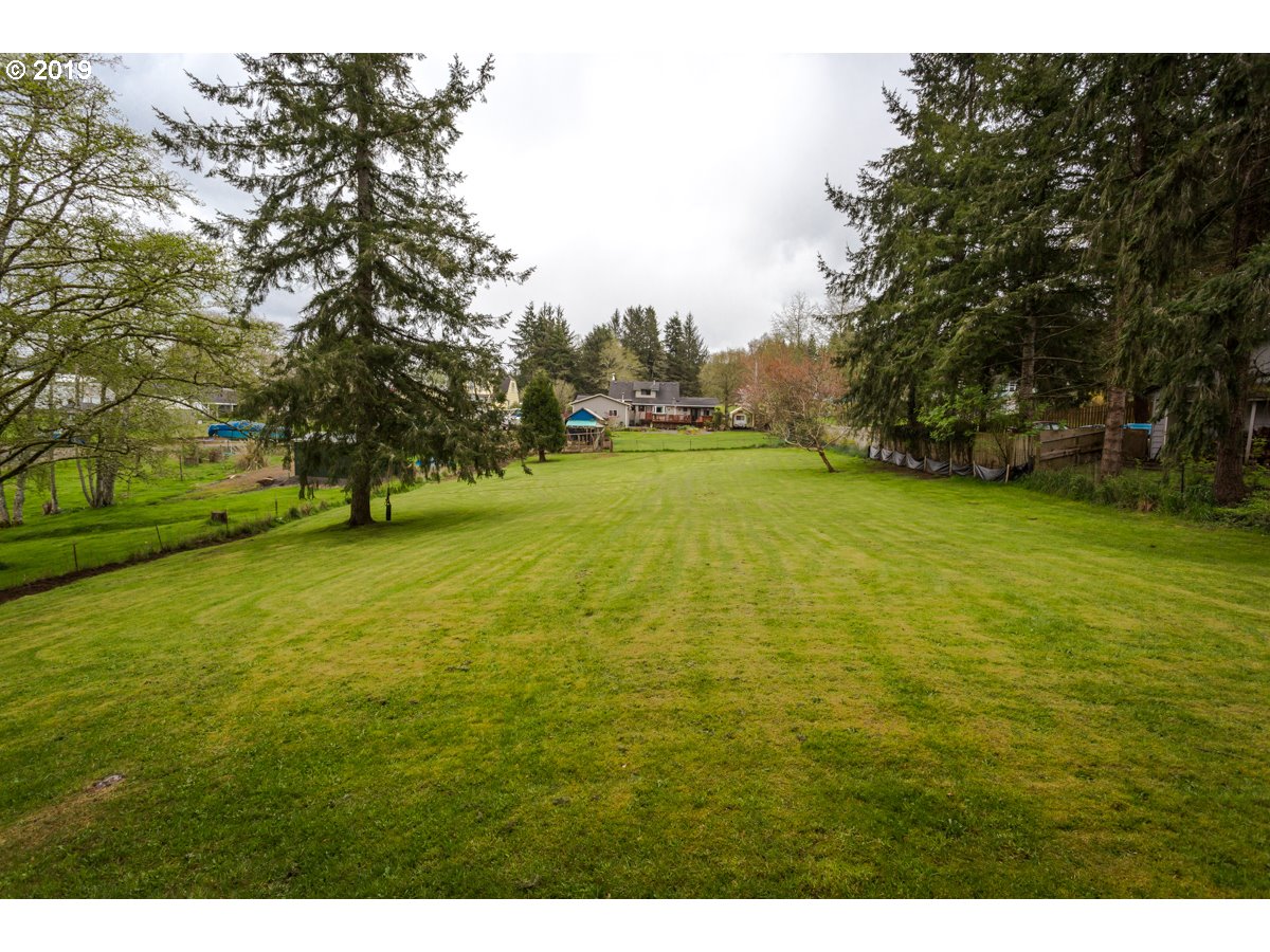 91978 Lewis And Clark Road Astoria, OR 97103 - Photo 31 of 32 a view of an ocean from a yard