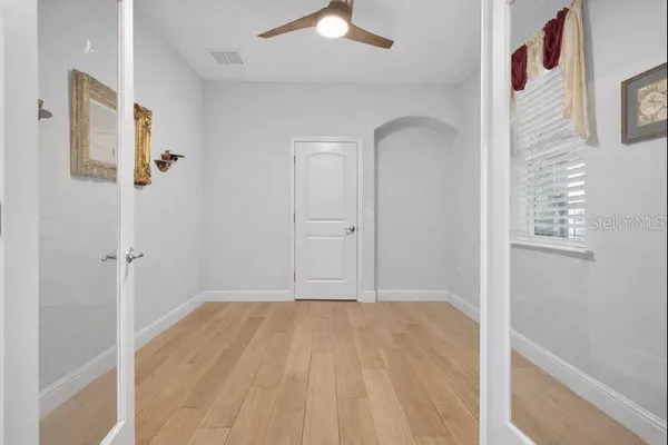 a bathroom with a double vanity sink a mirror and a shower