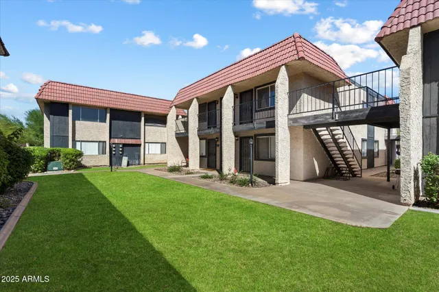 a front view of a house with a yard and porch