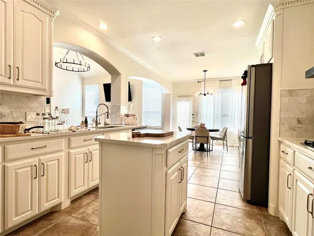a kitchen with counter top space and appliances