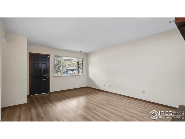 a black and white photo of a living room