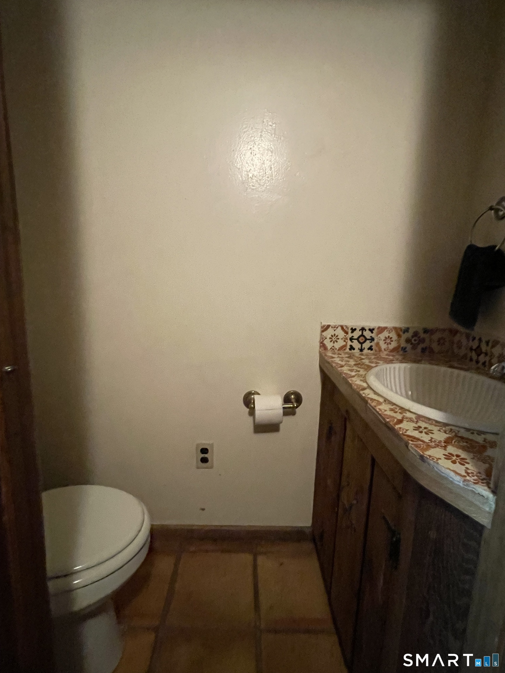 11 Tubbs Spring Drive Weston, CT 06883 - Photo 27 of 36 Powder room off family room leads you to mudroom laundry