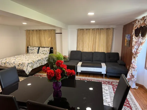 a bedroom with a bed and a mirror