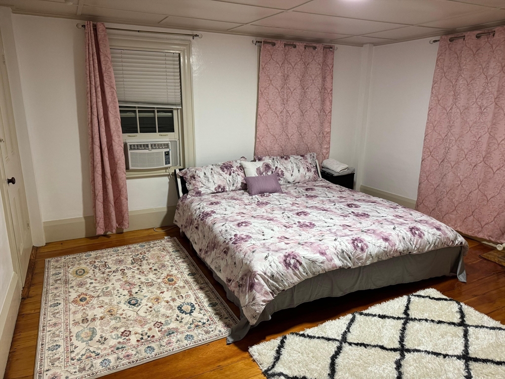 367 Maple Street, Unit MULTIFAMLY Danvers, MA 01923 - Photo 5 of 26 a bedroom with a bed and a window