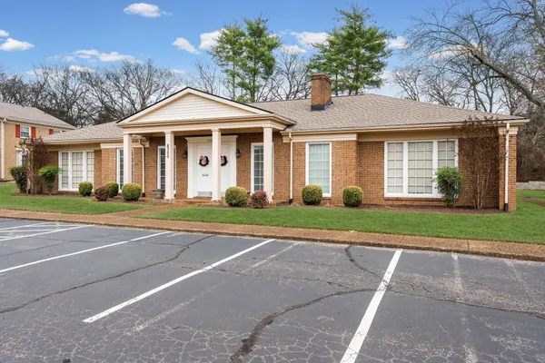 a view of a swimming pool with an outdoor space and seating area
