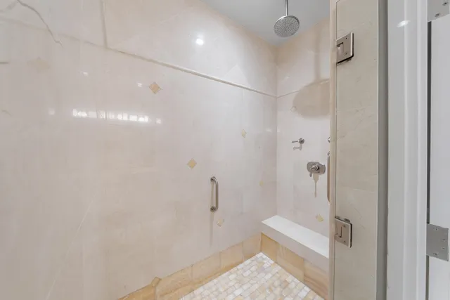 a bathroom with a shower and toilet
