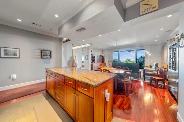 a room with lots of furniture and painting on the wall