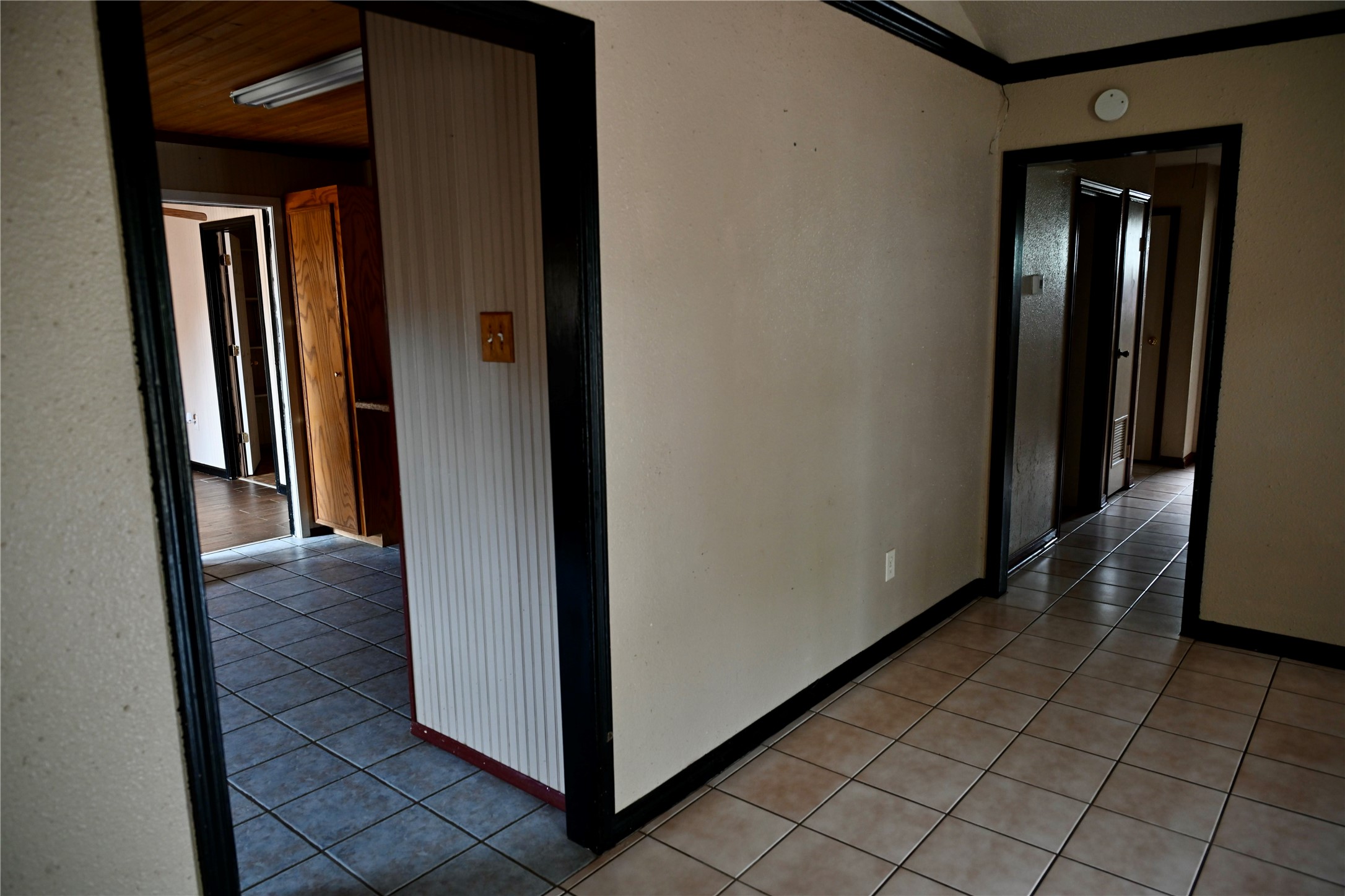 252 Bastrop Street Angleton, TX 77515 - Photo 13 of 28 a view of a hallway with wooden floor