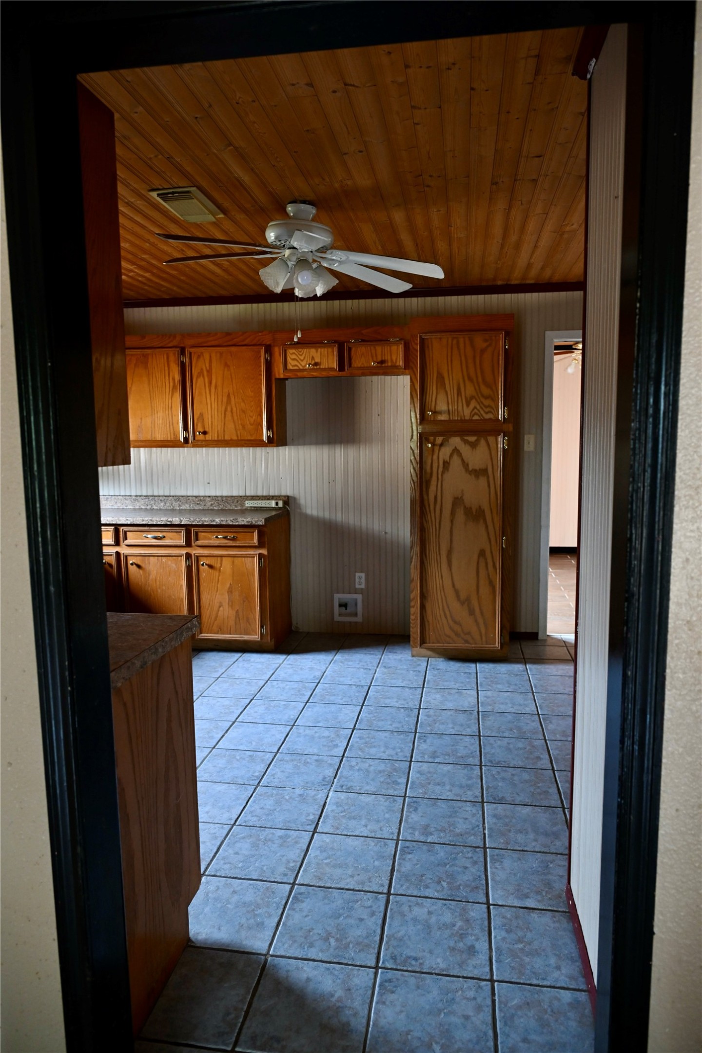 252 Bastrop Street Angleton, TX 77515 - Photo 14 of 28 a kitchen with kitchen island granite countertop a refrigerator and a sink