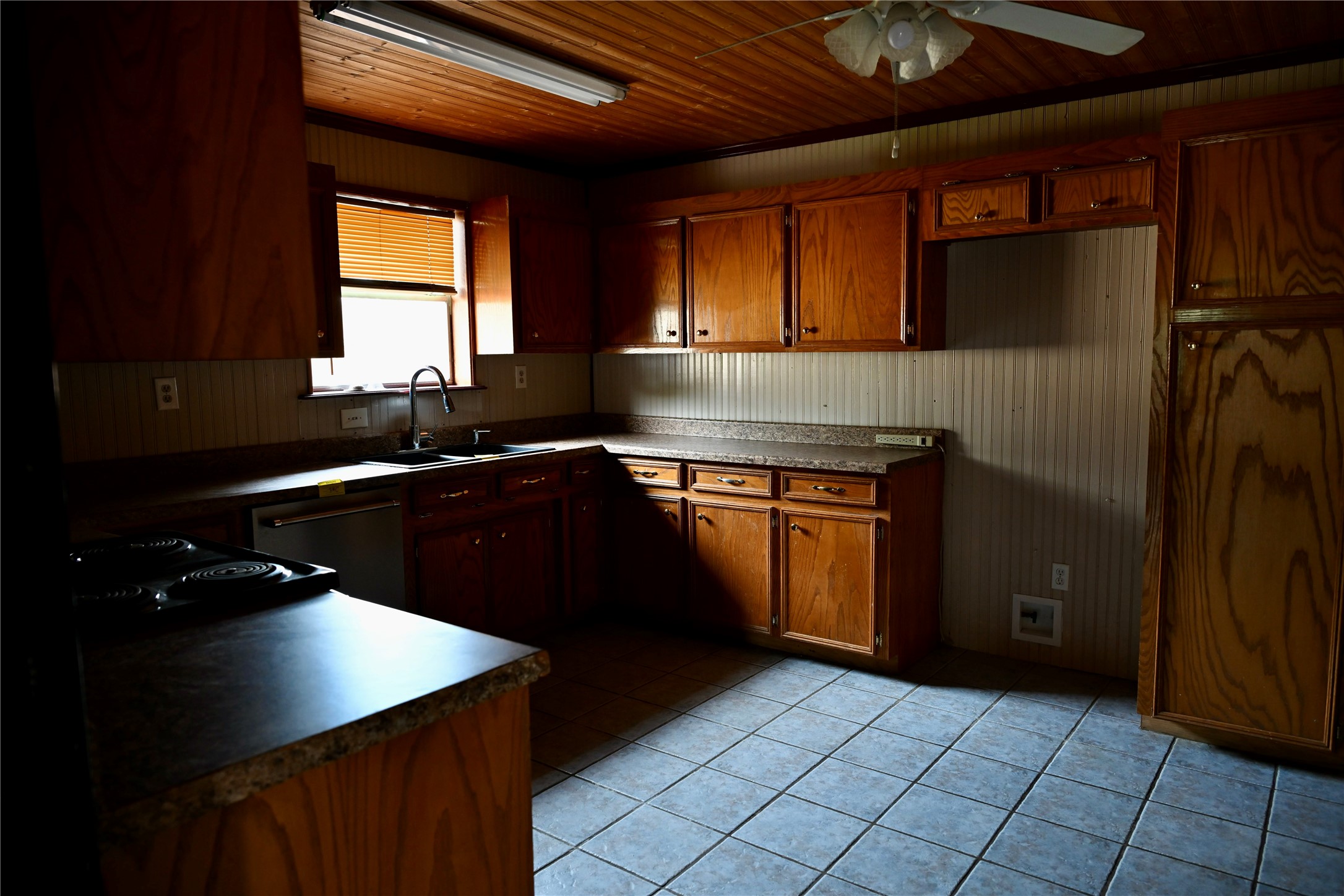 252 Bastrop Street Angleton, TX 77515 - Photo 15 of 28 a kitchen with a sink stove and cabinets