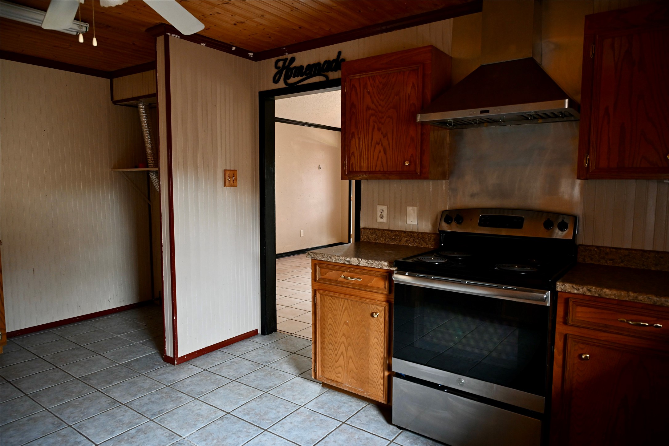 252 Bastrop Street Angleton, TX 77515 - Photo 16 of 28 a kitchen with a stove and a refrigerator