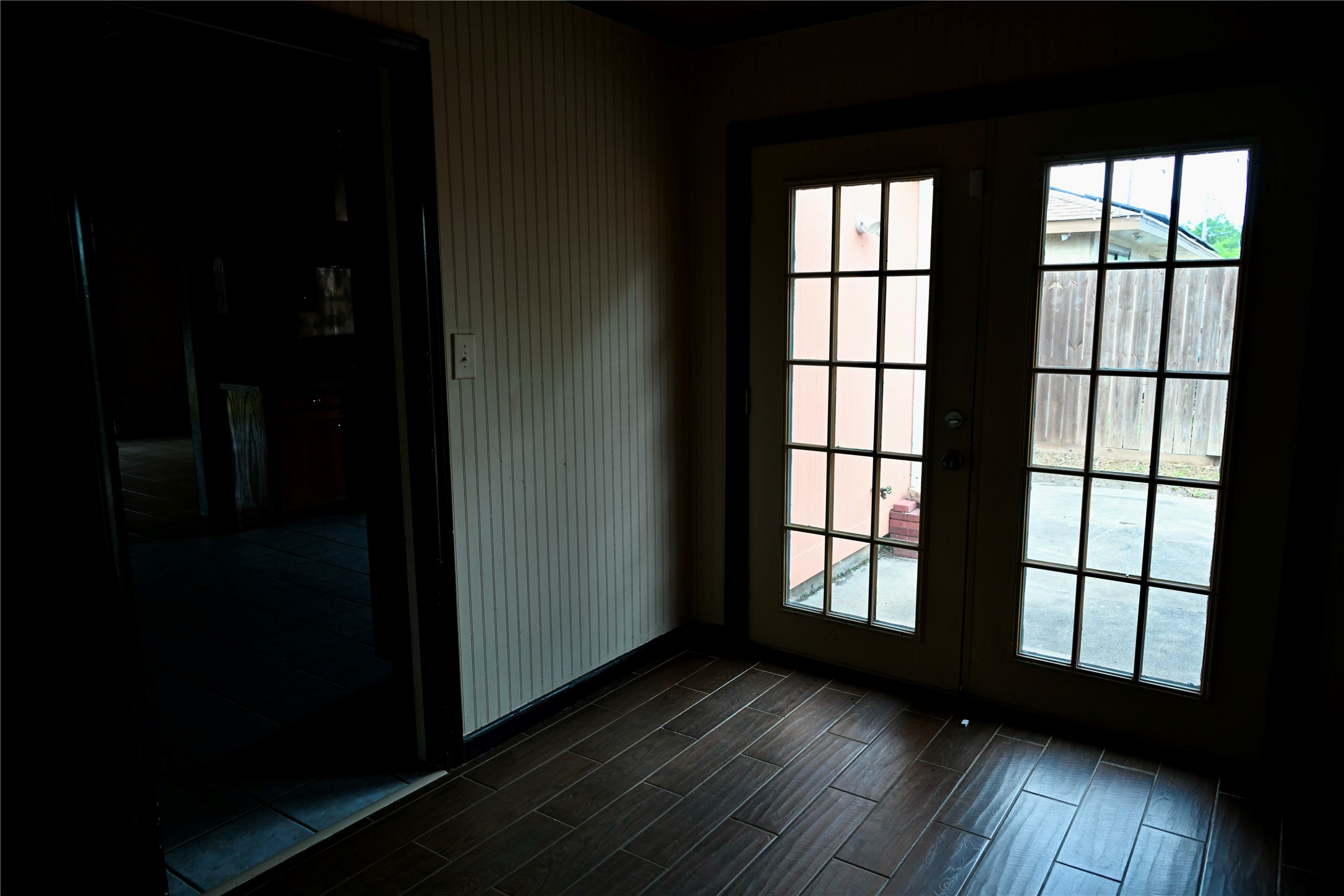 252 Bastrop Street Angleton, TX 77515 - Photo 21 of 28 a view of wooden floor and windows in an empty room